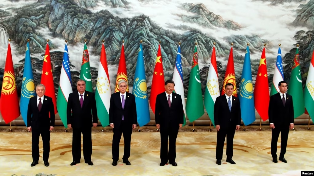 Asian leaders at diplomatic summit with national flags, representing balance of power in Asia You can copy and paste this into your image alt settings for best results!