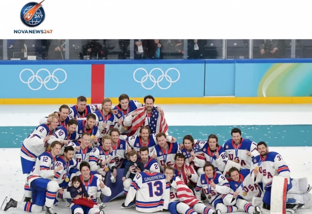 US men’s ice hockey team celebrating on the ice after a 2-1 overtime win against Canada to clinch Olympic gold at Milan-Cortina 2026.